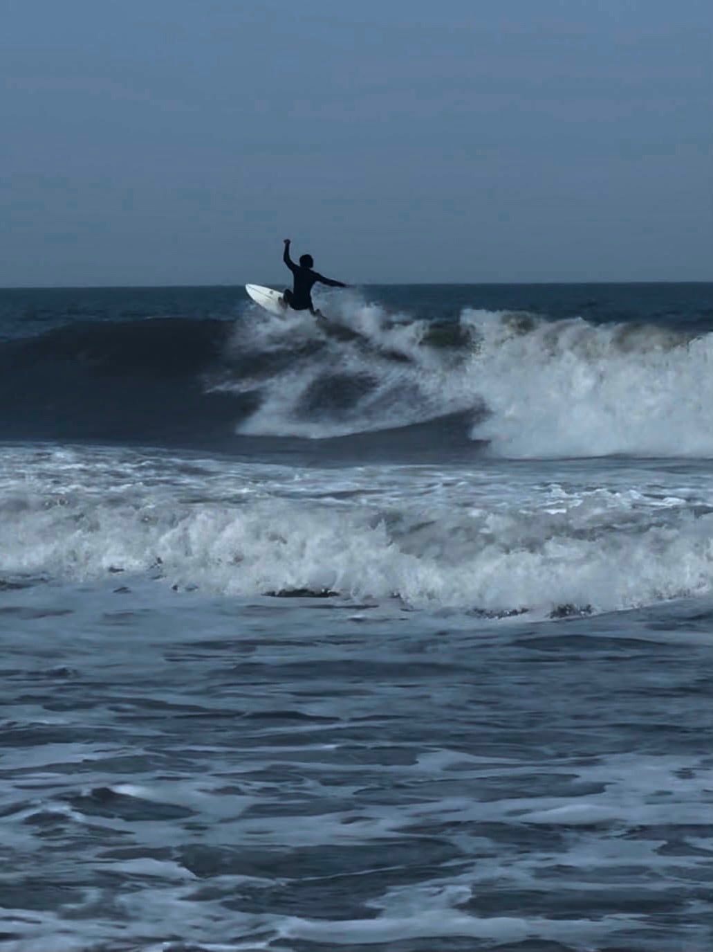 A surfer riding a wave